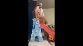 Grandmother's slide mishap while playing with grandson