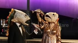 Activists wearing fish heads stage protest outside awards ceremony over cruel Scottish salmon farms in London