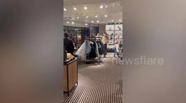 Shocking moment thieves raid Coach shop in California
