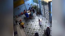 Cheeky toddler carries away chair as father goes to sit back down
