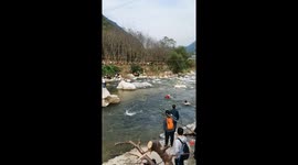 Heroic Rescue in China: Elderly Person Saved from Swift Waters of the River