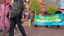 Crowds take part in a protest in Belfast, UK for action to save Lough Neagh