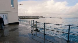 Abrupt Chaos erupts on Lambeth Walk, St Ives as extreme high tide floods the walkway.