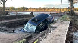 Car stuck in collapsed bridge after Storm Babet in Dundee, UK