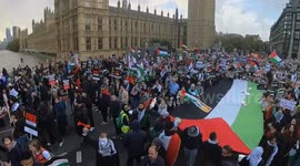 Fireworks and flares let off as large crowds of pro-Palestine protesters march across Westminster Bridge, past Big Ben and the London Eye, chanting and calling for a Ceasefire Now! Piers Corbyn also interviewed