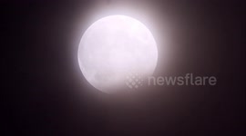 Stunning Hunter's Full Moon partial eclipse above Kent, UK