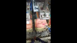 Eyes Stamped Onto Dolls at Factory