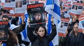 Hundreds hold 'kidnapped' posters outside London's Qatari embassy calling for the release of 203 hostages in Israel