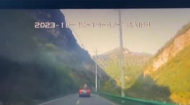 Motorists luckily avoid injuries as huge rocks tumble down mountain in southern China