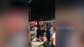 Revellers enjoy floating concert on canal in Thailand