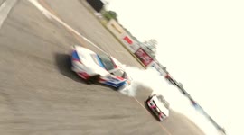 Amazing first-person view drone follows racing cars zipping on track