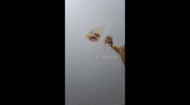 Artist sketches Billie Eilish portrait with coloured pencils