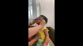 Heartwarming moment toddler sees clearly for the first time with pair of glasses