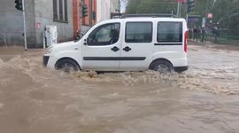 Italy storm: Milan streets inundated after heavy rain overnight