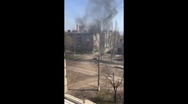 Utterly unfazed man's daring walk amidst shelled, smouldering buildings in Bakhmut, Ukraine