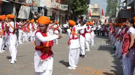 Indian girls demonstrate fearsome fighting skills with swords and sticks at Arya Samaj procession