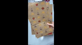 Woman recycles McDonald's paper bags and turns them into clothes