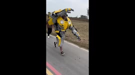 Transformers Bumblebee cosplayer chases minitruck along farm road in China