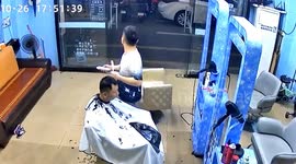 Quick-thinking barber dashes out of salon after scooter explosion in China