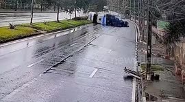 Truck delivering hens turns over on slippery road