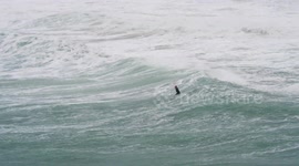 Storm Ciaran: Lone surfer braves rough sea despite weather warning in Cornwall