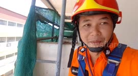 Hero firemen abseil to rescue kitten stranded on building ledge
