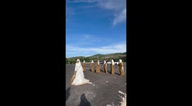 Hilarious moment bridesmaids run away from wedding bouquet