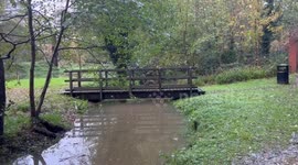 A bridge to Tanbridge House School is blocked by flood water next to the River Arun in Horsham West Sussex, UK