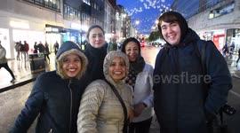 Excited Londoners cheerfully 'protest' for Oxford Street's Christmas lights to be switched on despite apparent delay