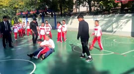 California Governor Newsom protects child during basketball tumble in China