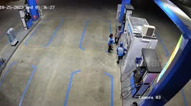 Bungling motorcycle rider accelerates into fuel station