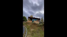 Risky roof jump ends with a bounce and a bang