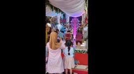 Traditional wedding mishap: bride's long head accessory amuses guests