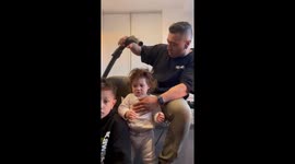 Vacuum magic: dad's clever hair styling trick wins hearts