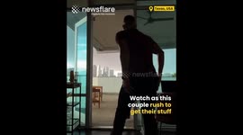 Couple rushes to save their furniture as a tornado hits