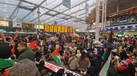 Free Palestone Protest Occupies Piccadilly Train Station. In Manchester, England