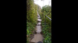 Heavy rain after Storm Ciaran creates flash waterfall onto beach