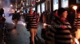 Crowds attend Lewes Bonfire night procession in East Sussex, UK