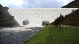 Caban Coch dam at Elan Valley overflows, following heavy rain.
