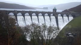 Craig Goch dam at Elan Valley overflows, following heavy rain.