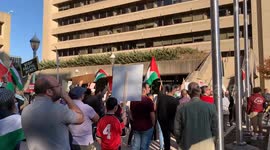 At a pro-Palestinian rally in Rockville, MD, rally-goers chant, “Ceasefire now!” while pro-Israeli counter-protesters yell at rally-goers.