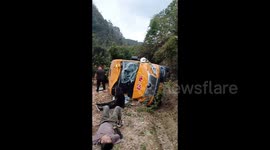 Six injured after school bus rolls down ditch in China