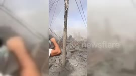 Gaza war: Clouds of dust and devastation after a strike on a house in Khan Yunis