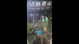 Flying bugs follow man's smartphone flashlight