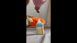 Father does Mission: Impossible style lowering of baby to grab milk bottle