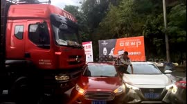Car driver luckily escapes as truck rams into the vehicle in road rage in China