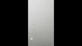 Debris floats through air during storm in Thailand