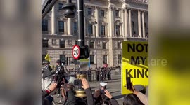 Anti-monarchy protesters shout at King's coach during the state opening of Parliament in London, UK