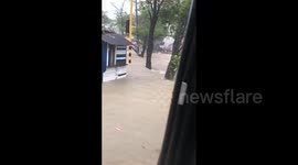 Cartagena's streets turn into rivers as locals playfully ride the floodwaters