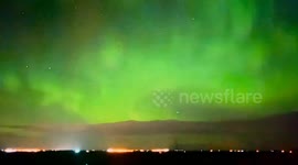 Green Aurora Borealis illuminates Carseland, Alberta's night sky
